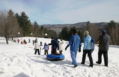 Campers walking toward the tubing run 3